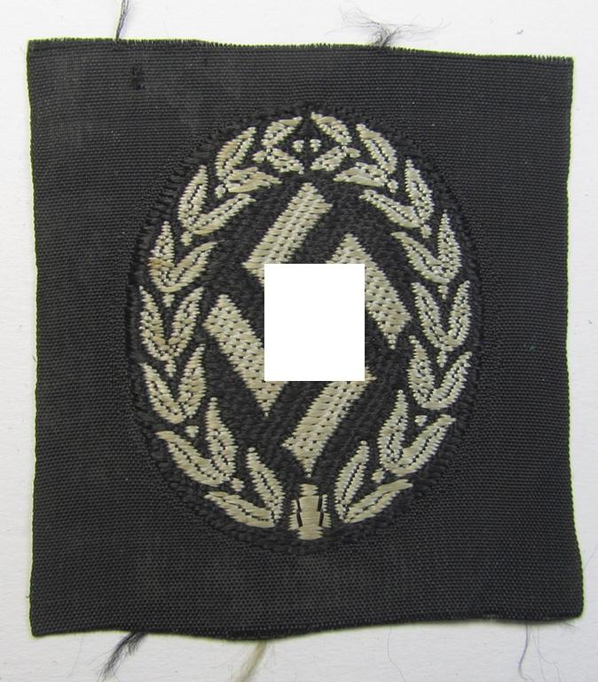 Superb - and scarcely encountered! - I deem EM- (ie. NCO-) type, so-called: 'Schutzmannschaften' (or: 'Schuma') cap-cocarde as executed in greyish-coloured thread on a black-coloured- (ie. 'Polizei'-related-) background