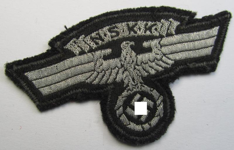 Attractive, so-called: N.S.K.K. (ie. 'National Socialistisches Kraftfahr Korps') arm-eagle as executed in so-called: flatwire, 'BeVo'-weave pattern and comes mounted onto a black-coloured background