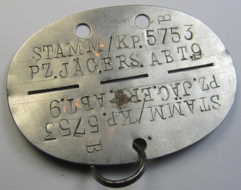 Attractive - and actually scarcely seen! - stainless-steel-based, WH (Heeres) ie. 'Panzerjäger'-related ID-disc bearing the clearly stamped unit-designation that simply reads: 'Stamm/K.Pz.Jäg.Ers.Abt. 9'