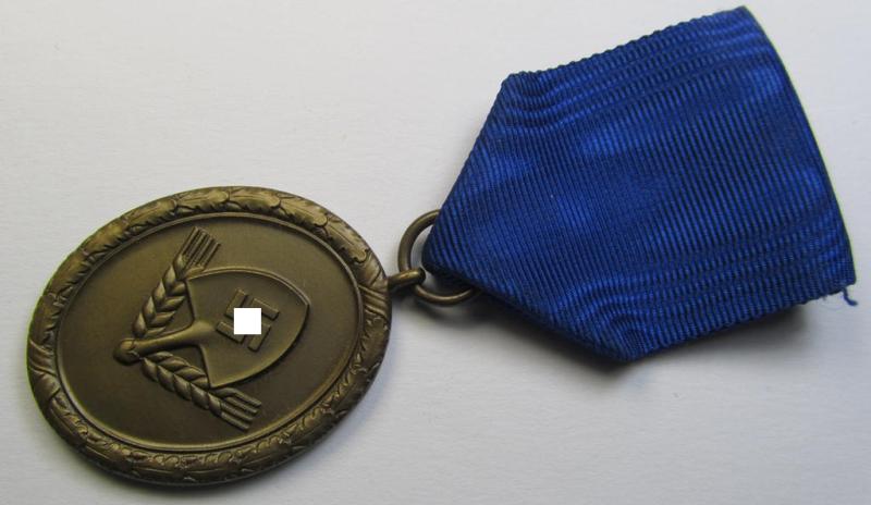 Superb example of a: RAD (ie. 'Reichsarbeitsdienst') so-called: 'Dienstauszeichnung 4. Stufe für Männer' as was intended for 4 years loyal-service and that comes mounted onto its period piece of ribbon (ie. 'Bandabschnitt')