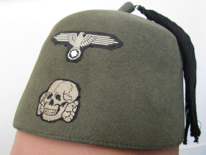 Superb, field-grey- (ie. light-green-) coloured and/or woolen-based so-called: Waffen-SS 'Fez' (being a 'virtually mint- ie. unissued' example having a neat - and fully matching! - set of silver-grey-coloured 'BeVo'-insignia originally attached)