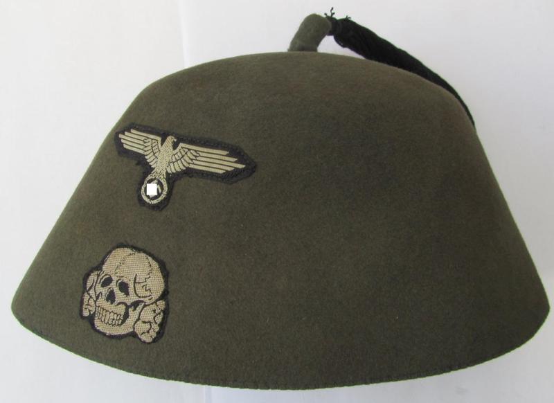 Superb, field-grey- (ie. light-green-) coloured and/or woolen-based so-called: Waffen-SS 'Fez' (being a 'virtually mint- ie. unissued' example having a neat - and fully matching! - set of silver-grey-coloured 'BeVo'-insignia originally attached)