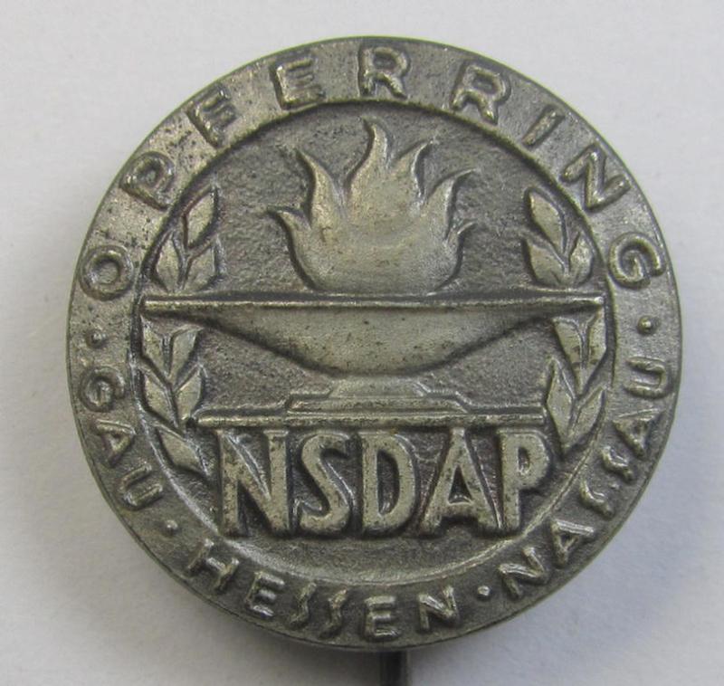 Attractive, zinc- (ie. 'Feinzink'-) 'N.S.D.A.P.'-related supporter-pin- (or: 'Freiheitsbund-Abzeichen') being a maker- (ie. 'E.F. Wiedmann'-) marked example showing the text: 'Opferring Gau Hessen-Nassau'