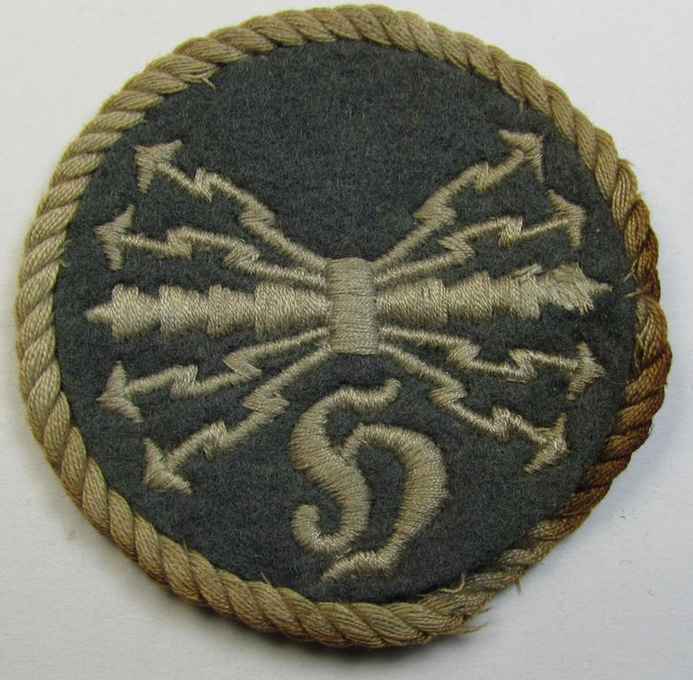 Attractive - albeit clearly used! - example of a WH (Luftwaffe) machine-embroidered, trade- ie. special-career-patch (ie. 'Tätigkeitsabzeichen') having a silver-white-toned 'Kordel' attached as was intended for: 'LW-Horchfunker'-staffmembers