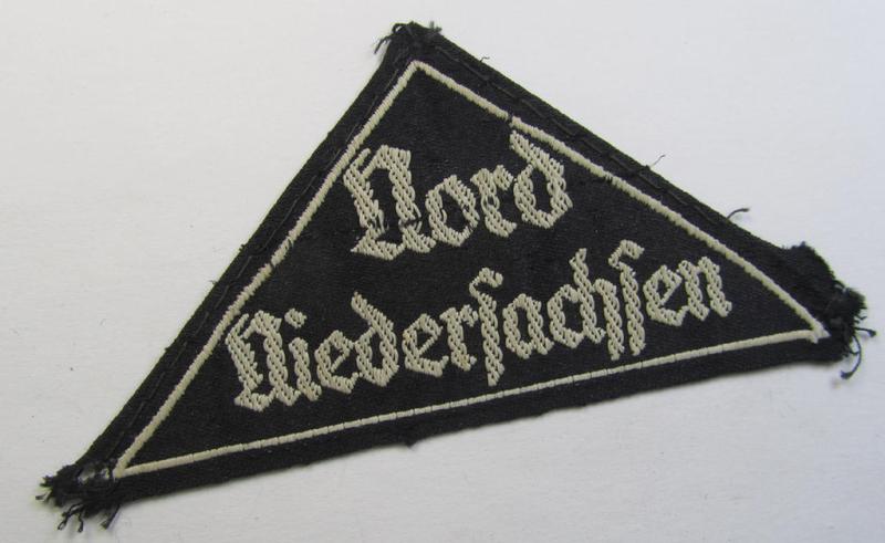 HJ/BDM ('Hitlerjugend' ie.: 'Bund Deutscher Mädel') district-triangle (ie. 'Gebietsdreieck') being an example that misses its 'RzM-etiket' and that is entitled: 'Nord Niedersachsen' and that comes in a tunic- ie. shirt-removed, condition