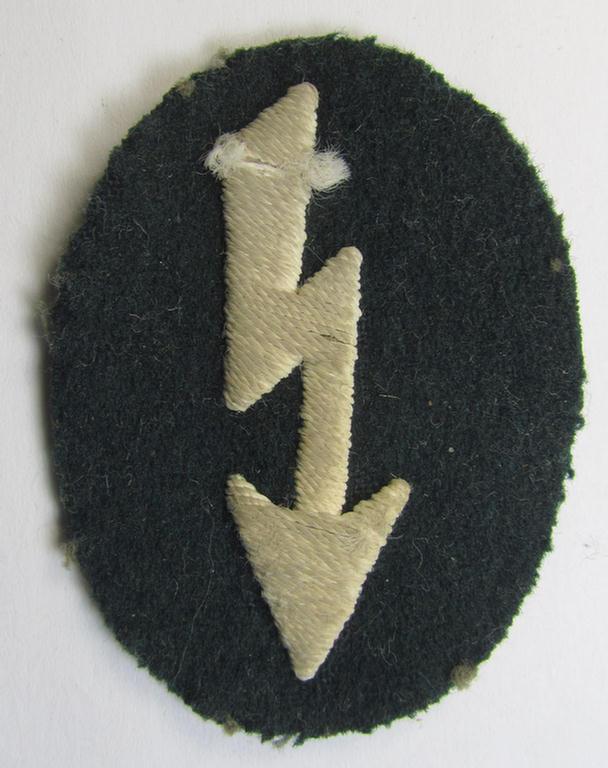 Clearly used- & tunic-removed WH (Heeres) trade- and/or special career insignia ie. hand-embroidered signal-blitz (being a neatly maker-marked example as executed in white) as was intended for a soldier serving within the: 'Infanterie-Truppen'