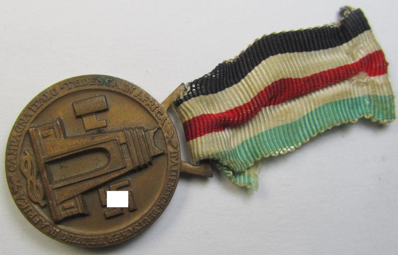 Superb, golden-bronze-coloured- (and I deem 'Buntmetall'-based-) example of a: 'Deutsch-Italienische Feldzugsmedaille' (or: German-Italian campaign medal) that comes mounted on its (regular-sized-) piece of original ribbon