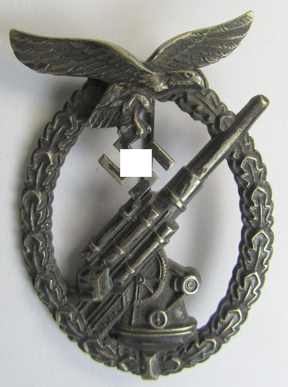 Superb, very early-period 'nickle-silver'-based- example of a maker- (ie. 'Brehmer'-) marked WH (Luftwaffe) 'Flakkampfabzeichen' (or: airforce anti-aircraft badge) being a detailed example as was produced by the: 'Gustav Brehmer'-company