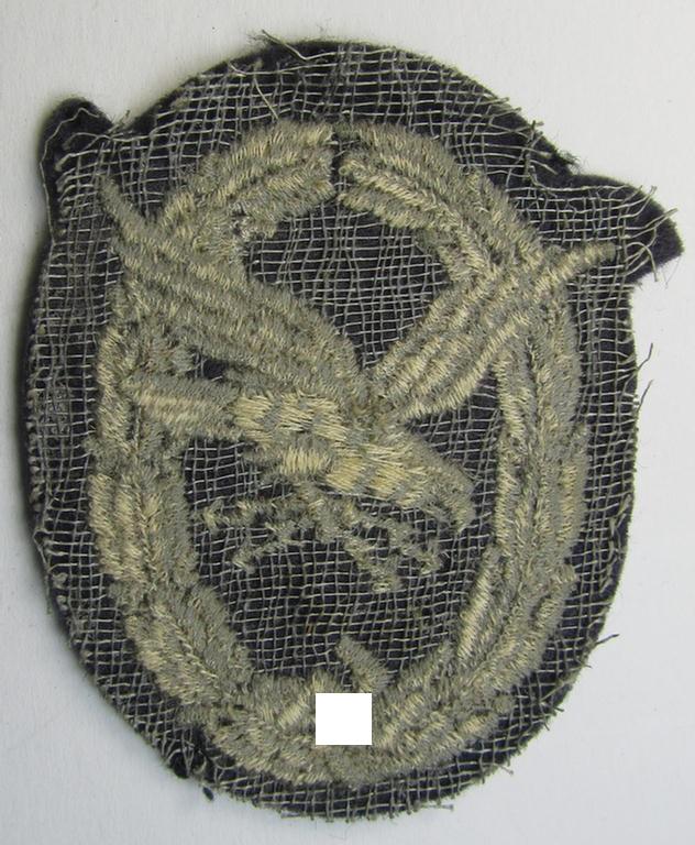 Attractive example of a WH (Luftwaffe) so-called: 'Fliegerschützen-Abzeichen mit Blitzbündel in Stoff' (or: cloth air-gunners-badge with lightning-bolts) being a nicely executed and typical machine-embroidered specimen
