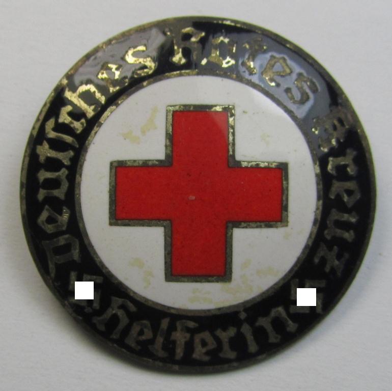 Attractive example of a DRK (ie. 'Deutsches Rotes Kreuz' or German Red Cross) nurses'-badge as was intended for a: 'Helferin' being a maker- (ie. 'E.L.M.'-) marked example that comes in a fully untouched condition
