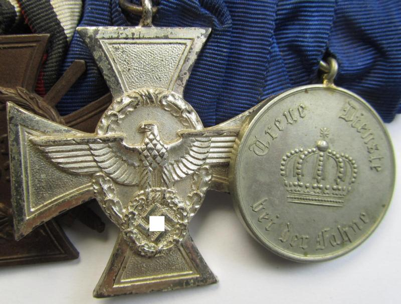 Attractive, 4-pieced medal-bar (ie. 'Ordenspange') resp. depicting a WWI-period: 'EK II. Klasse', a: 'FKK 1914-18 m. Schw.', a: 'Polizei-DA 2.St.' and a Prussian: 'DA 3.Klasse 1913 für 9 Jahre treue D.'