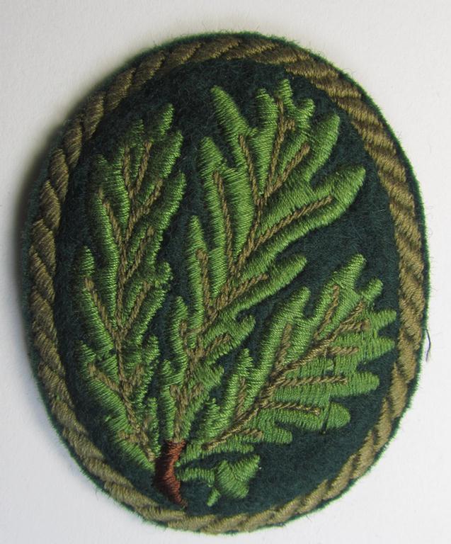 Attractive - and I deem moderately used! - example of a WH (Heeres) so-called: 'Jäger'-armbadge being a neatly machine-embroidered- and/or multi-coloured version as was executed on darker-green-coloured wool