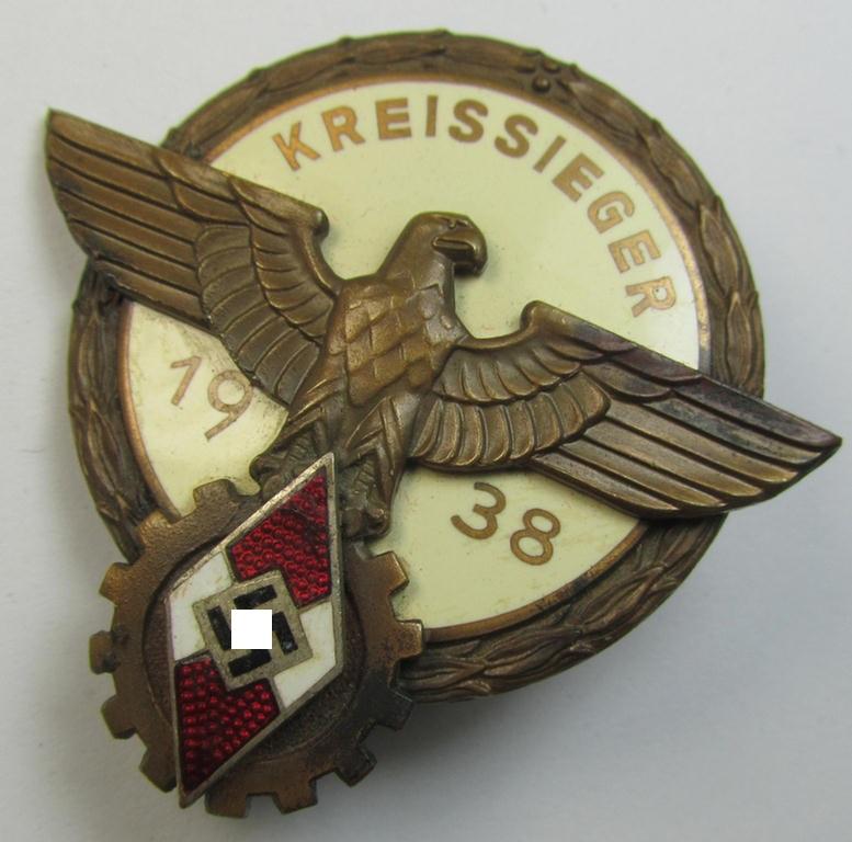 Superb, 'HJ'- ('Hitlerjugend') ie. 'BDM'- ('Bund Deutscher Mädel') related: 'Reichsberufswettkampf-Siegerabzeichen' (of the 2nd model) entitled: 'Kreissieger 1939' and being a neatly maker- (ie.: 'G. Brehmer'-) marked example