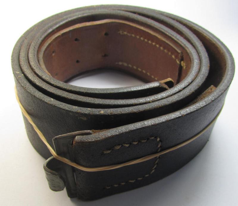 Attractive, regular sized- and mid-war-period, black-coloured WH (Heeres) 'standard-issue'-pattern belt (ie. 'Koppelriemen') being a 95 cms. sized example that shows a clearly present makers'-designation ('E.D. Götze & Sohn') and/or date: 1942