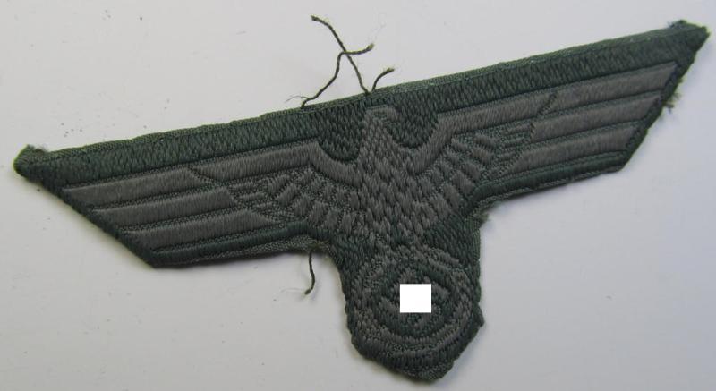 Early- (ie. mid-war-) period, WH (Heeres) cap-eagle (ie. 'Schiffchen-Adler für Mannschaften u. Unteroffiziere') being a slightly used ie. cap-removed example as executed in bluish-grey-coloured linnen on a field-grey-coloured background