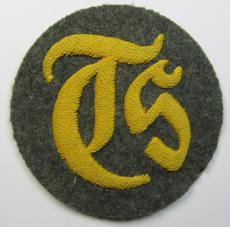 Superb - and rarely encountered! - WH (Heeres) hand-embroidered, trade- and/or special-career insignia (ie. 'Tätigkeitsabzeichen') as executed on a field-grey-coloured background as was intended for a: 'Truppensattlermeister'