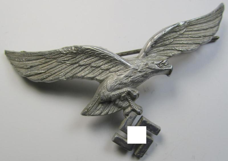 Attractive - and clearly used- ie. worn - WH (Luftwaffe) metal- (ie. aluminium-) based breast-eagle as was intended for usage on the white summer-tunics (ie. 'Brustadler für Sommerrock') being a detailed- (albeit non-maker-marked-) specimen