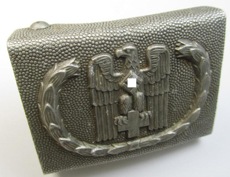 Superb, aluminium-based, so-called: DRK (ie. 'Deutsches Rotes Kreuz'), EM- (ie. NCO-) type belt-buckle being a clearly maker- (ie. 'JFS' and/or: 'Ges.Gesch.'-) marked example that comes in a minimally worn- and/or hardly used, condition