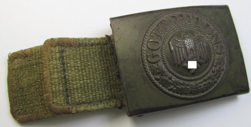 Neat, WH (Heeres) 'tropical-issued' belt-buckle (being a non-maker-marked and/or typical olive-green-coloured) example that comes mounted onto its original, greenish-coloured (and/or: 'webbing'-based-) tab
