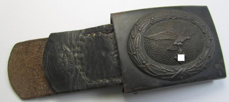 Moderately used WH (LW) 'standard-pattern', steel-based belt-buckle (ie. 'Koppelschloss für Uffz. u. Mannschaften der LW') being a maker- (ie. 'Brüder Schneider A.G.'-) marked- and/or: '1940'-dated example that comes mounted onto its period tab