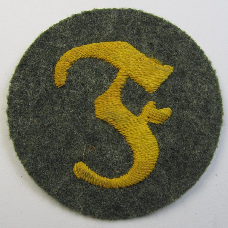 WH (Heeres) so-called: trade- and/or special-career arm-insignia (ie. 'Laufbahn- o. Tätigkeitsabzeichen') as was specifically intended for an army: 'Feuerwerker' (being a neatly hand-embroidered variant on field-grey-coloured wool)