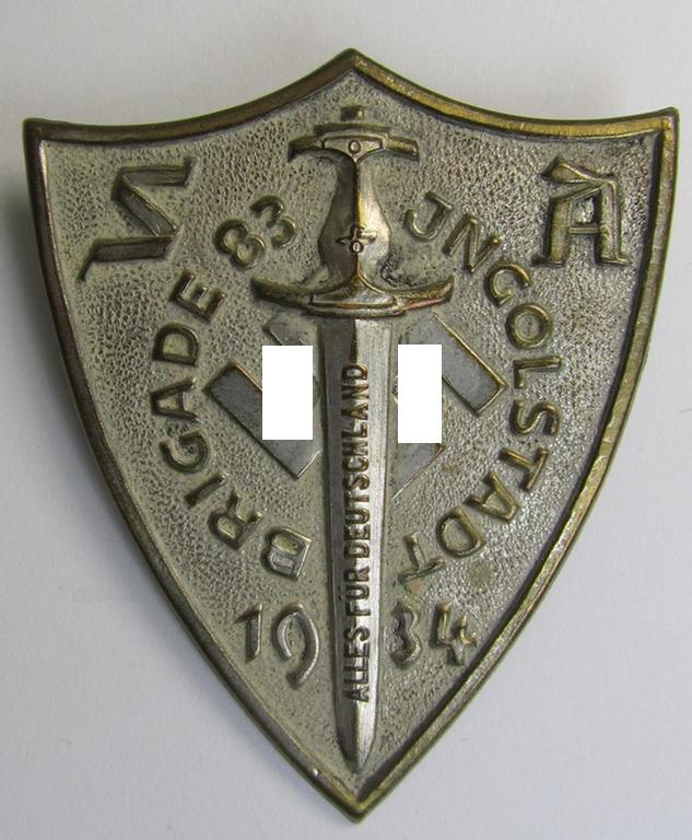 Superb - and rarely found! - commemorative, silver-toned- and tin-based - SA- (ie. 'Sturmabteilungen'-) related 'tinnie' depicting an SA-dagger, swastika and text (ie. date) that reads: 'Brigade Ingolstadt 1934'