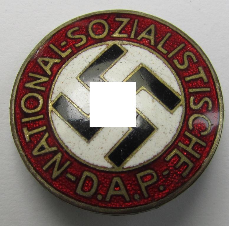 Neatly enamelled- (and bright-red-coloured) 'N.S.D.A.P.'-membership-pin- ie. party-badge (or: 'Parteiabzeichen') which is nicely maker-marked on the back with the makers'-designation: 'RzM' and/or: 'M1/52'