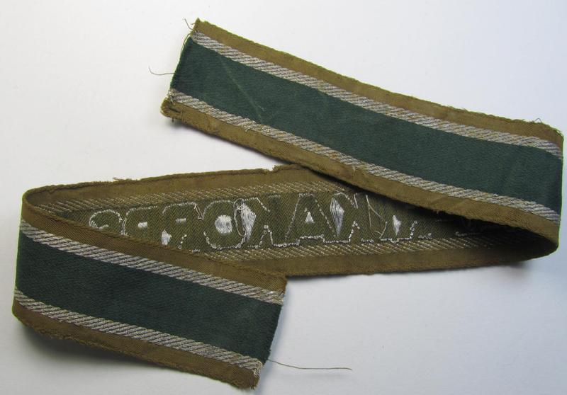 Attractive, 'BeVo'-like cuff-title (ie. 'Ärmelstreifen') entitled: 'Afrikakorps' being a with certainty issued and truly worn example that comes in an overall nice- (ie. minimally shortened- and once tunic-attached-), condition