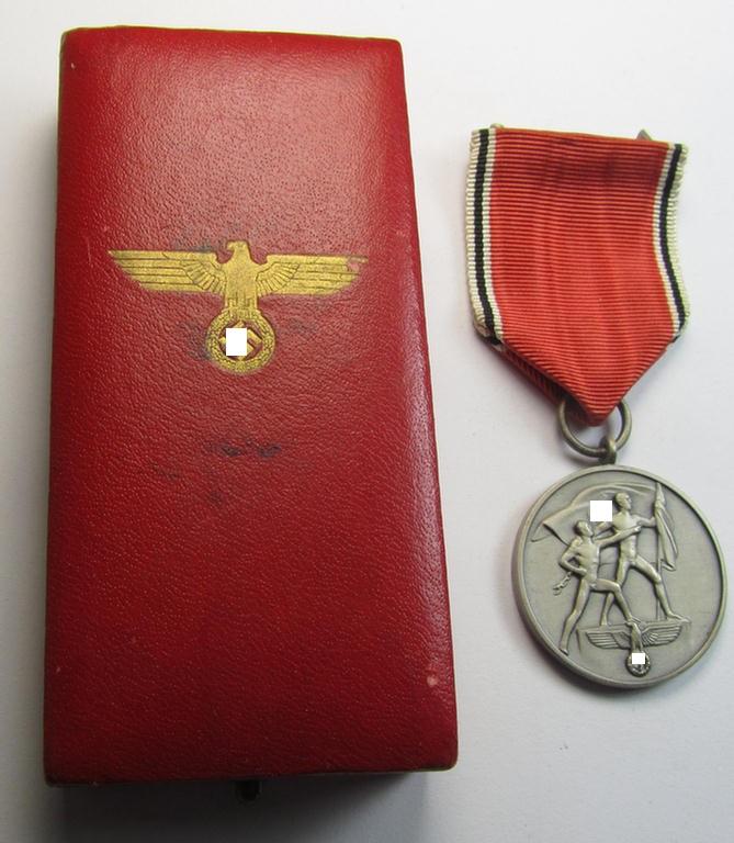 Superb, WH Austrian-occupation- (ie. 'Anschluss'-) medal: '1. März 1938' being an attractive and just minimally tarnished example that comes stored in its bright-red-coloured- and/or non-maker-marked etui as issued
