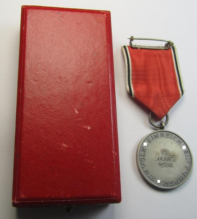 Superb, WH Austrian-occupation- (ie. 'Anschluss'-) medal: '1. März 1938' being an attractive and just minimally tarnished example that comes stored in its bright-red-coloured- and/or non-maker-marked etui as issued