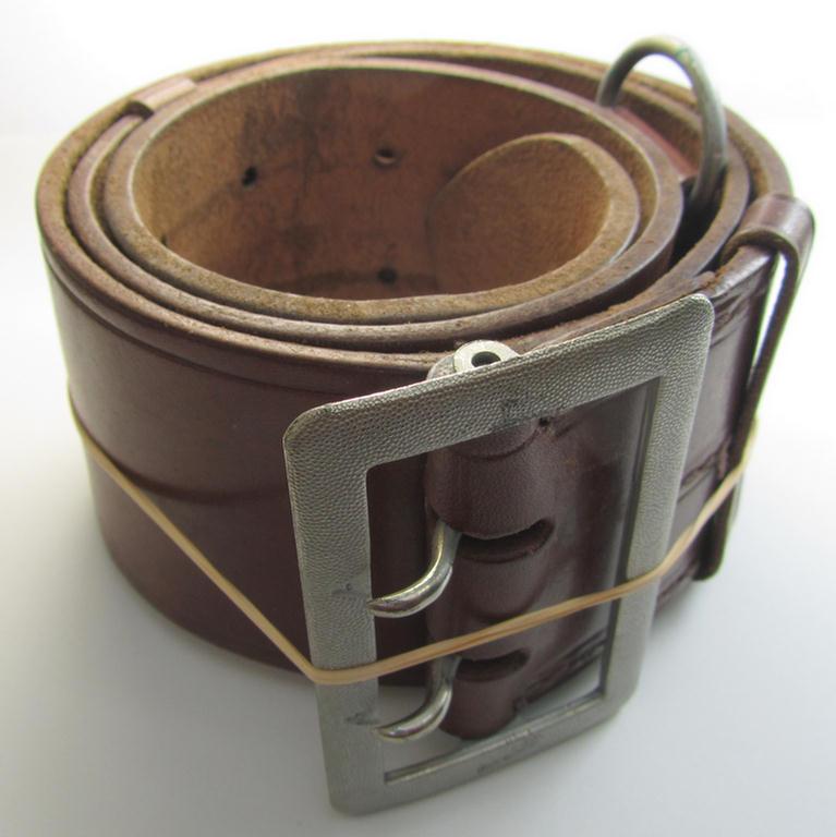 Superb, WH (Heeres-, Luftwaffe ie. Waffen-SS) light-brown- (ie. natural-) coloured- and/or genuine leather-based officers'-type-belt (ie. 'Zweidornschnalle für Offiziere') being a moderately used- ie. worn example that is void of a makers'-designation