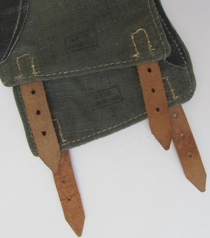 Fully matching pair of WH (Heeres, Luftwaffe etc.) greenish-brown-coloured- and/or partly leather-based, so-called: 'Gamaschen' (ie. gaithers) both pieces being maker-marked examples that come in a 'virtually mint- ie. unissued'-, condition