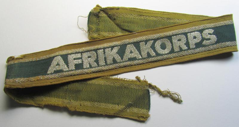 Atttractive, 'BeVo'-like cuff-title (ie. 'Ärmelstreifen') entitled: 'Afrikakorps' being a with certainty issued and truly worn example that comes in an overall nice- (ie. non-shortened- and most certainly once tunic-attached-), condition