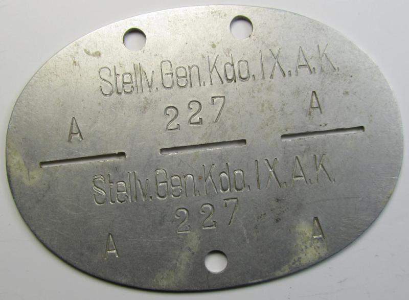Aluminium-based, WH (Heeres) 'Stab'- (ie. 'Wehrkreis'-) related ID-disc bearing the clearly stamped unit-designation that simply reads: 'Stellv.Gen.Kdo.IX.A.K.' and that comes as issued- and/or worn