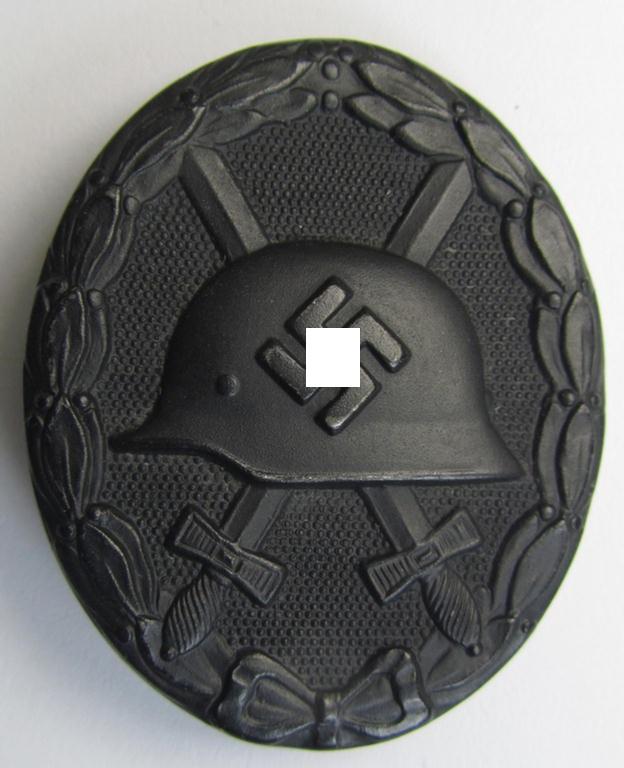 Dual-maker- (ie. 'K&Q'- and '65'-) marked example of a black-class wound-badge (or: 'Verwundeten-Abzeichen in Schwarz') being an example that was produced by the maker (ie. 'Hersteller') named: 'Klein & Quenzer'
