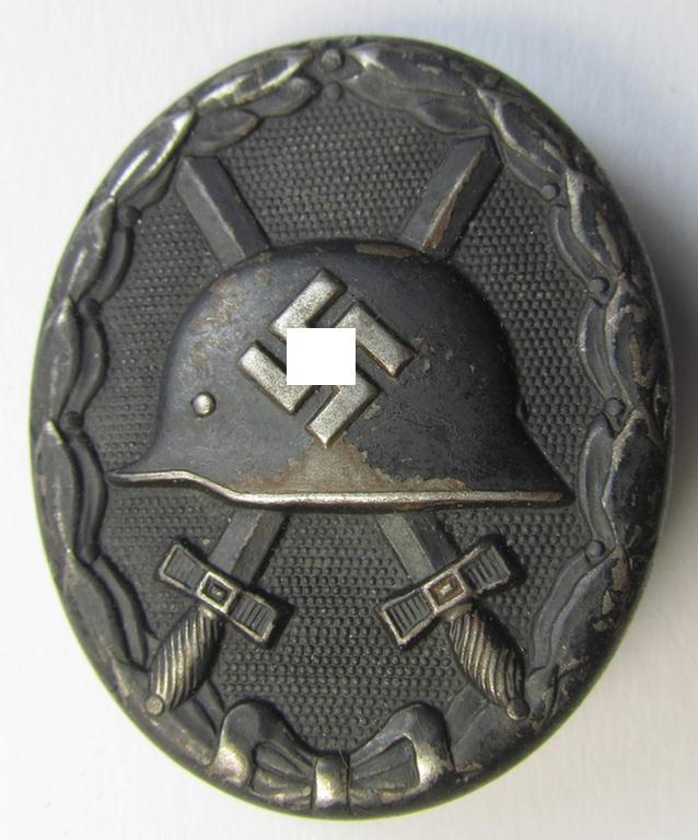 Neatly maker- (ie. 'L/56'-) marked example of a black-class wound-badge (or: 'Verwundeten-Abzeichen in Schwarz') being an example that was produced by the maker (ie. 'Hersteller') named: 'Funcke & Brüninghaus'