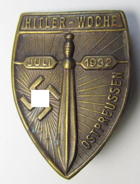 Superb - and truly rarely found! - commemorative, golden-bronze-toned- and tin-based - N.S.D.A.P.-related 'tinnie' depicting a sword, 'sunburst'-swastika and text (ie. date) that reads: 'Hitler-Woche - Ostpreussen - Juli 1932'