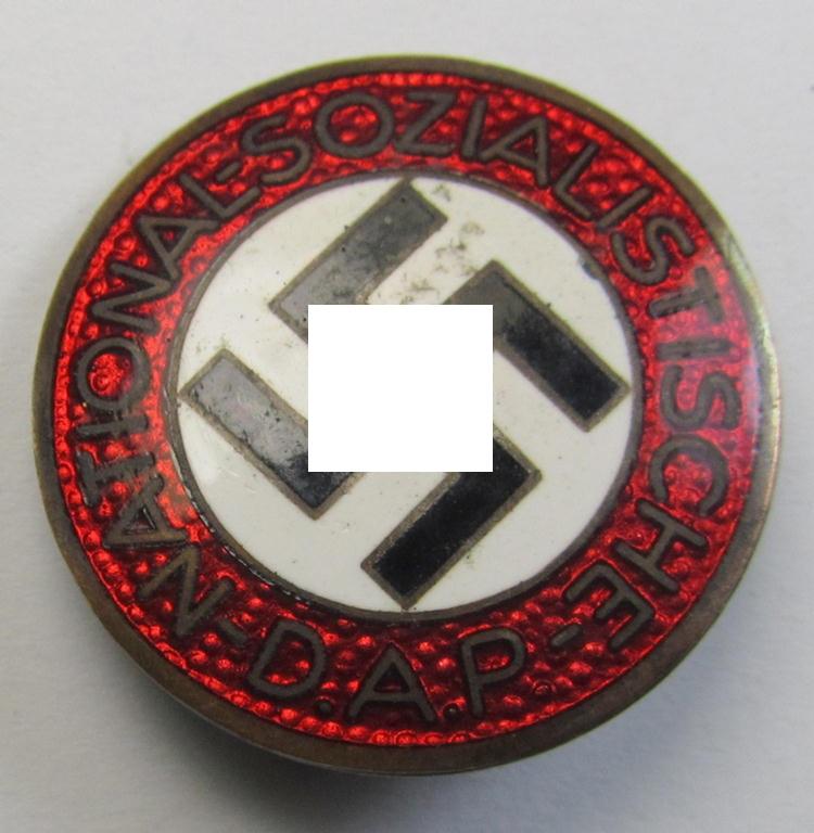 Neatly enamelled- (and bright-red-coloured) 'N.S.D.A.P.'-membership-pin- ie. party-badge (or: 'Parteiabzeichen') which is nicely maker-marked on the back with the (rarely seen!) makers'-designation: 'RzM' and/or: 'M1/62'