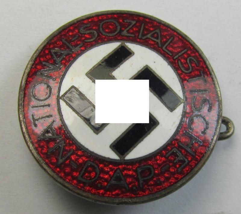 Neatly enamelled- (and darker-red-coloured) 'N.S.D.A.P.'-membership-pin- ie. party-badge (or: 'Parteiabzeichen') which is nicely maker-marked on the back with the (rarely seen!) makers'-designation: 'RzM' and/or: 'M1/128'