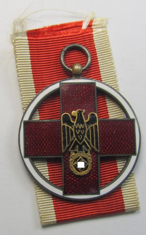 Superb - and nicely enamelled! - so-called: 'DRK-Ehrenzeichen des 3. Modell' that comes together with its original (regular-sized) ribbon (ie. 'Bandabschnitt') as issued and/or stored for decades