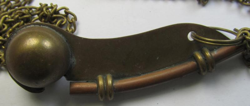 Neat, WH (Kriegsmarine) personal-equipment-item: a golden-bronze-coloured- and (I deem) copper based flute (ie. 'Bootsmanns-Flöte') that comes mounted onto its original also copper-based 'chain'