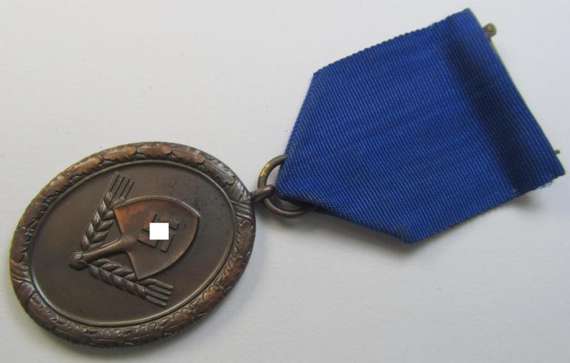 Attractive example of a: RAD (ie. 'Reichsarbeitsdienst') so-called: 'Dienstauszeichnung 4. Stufe für Männer' as was intended for 4 years loyal-service and that comes mounted onto its period piece of ribbon (ie. 'Bandabschnitt')