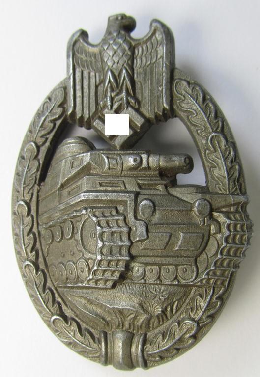 'Panzerkampfabzeichen in Bronze' (or:bronze-class panzer-assault badge or PAB) being a later-war-period, non-maker-marked- and/or typical zinc- (ie. 'Feinzink'-) based 'Daisy'-specimen as was procuced by the maker: 'Schauerte & Höhfeld'