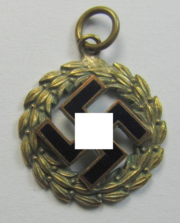 Unusually seen, female-related, golden-toned - and nicely enamelled! - patriotic hanger (ie. 'N.S.D.A.P.-supportive piece) being an attractive example that shows a black-coloured swastika surrounded by a golden-coloured rim