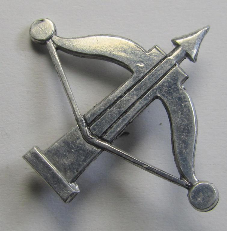Superb, WH (Heeres) so-called: 'Truppen-Traditionsabzeichen des 50. Infanterie-Division' depicting the 'bow-and-arrow'-illustration and being executed in (typical) aluminium-based metal and still retaining both its period-attached prongs