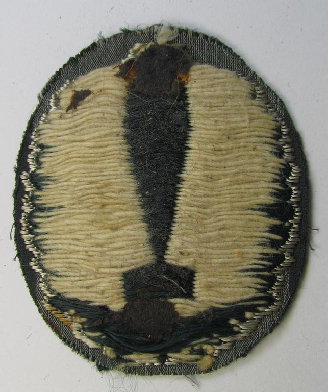 Superb - and extremely rarely encountered! - 'BeVo'-woven version of a WH (Heeres) so-called trade- and/or special-career insignia as was intended for a: 'Nebelwerfer Richtkannonier' (or: qualified smoke-troops canon-operator)