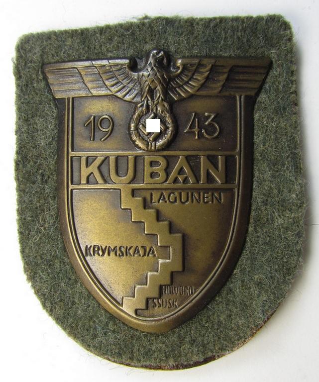 Very attractive - and actually scarcely encountered! - WH (Heeres ie. Waffen-SS) 'Kuban'-campaign-shield that comes mounted onto its original field-grey-coloured- and/or woolen-based 'backing'