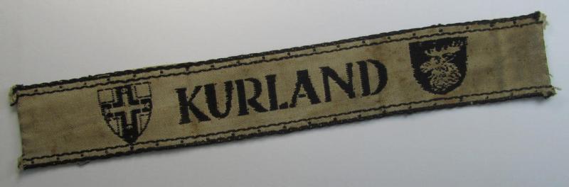 Superb, full-length example of a WH (Heeres ie. Kriegsmarine) cuff-title- ie. armband (ie. 'Ärmelstreifen') entitled: 'Kurland' that comes in an overall very nice- (albeit clearly used- ie. tunic-removed-), condition