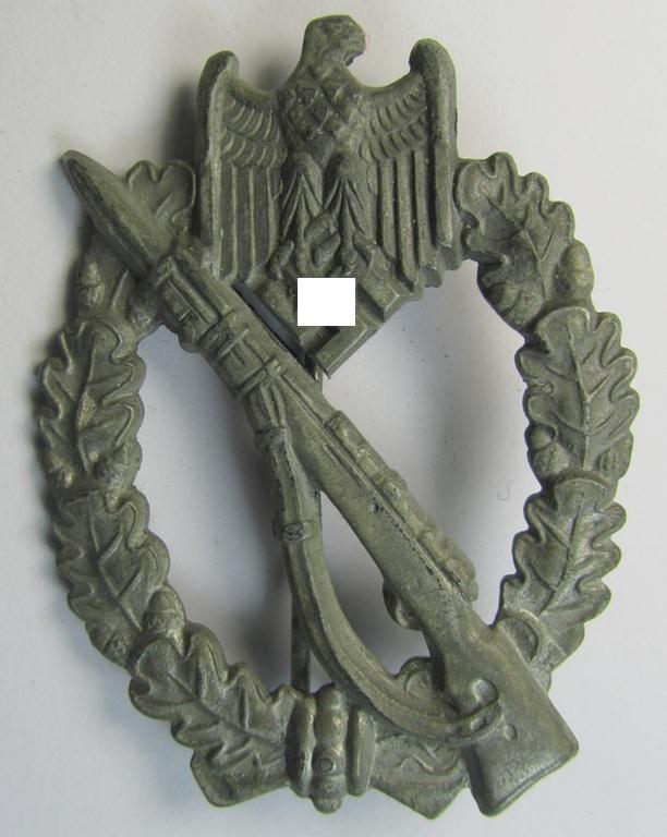 Attractive - and moderately used! - 'Infanterie-Sturmabzeichen in Silber' (or: silver-class infantry-assault badge ie. IAB) being a neatly maker- (ie. 'ÜÜ'- or: 'Hermann Wernstein'-) marked example as executed in silverish-grey-coloured 'Feinzink'