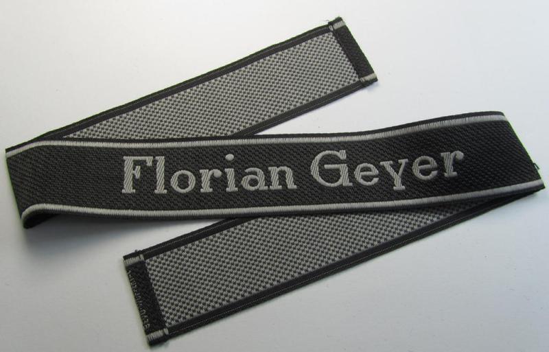 Stunning, Waffen-SS, 1943-pattern cuff-title (ie. 'Ärmelstreifen') depicting the machine-woven Latin script text in silver-grey linnen, as was intended for a member of the: '8. SS-Kavallerie-Division “Florian Geyer”
